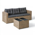 Zestaw wypoczynkowy z technorattanu beżowy z ciemnoszarymi poduszkami i czarnym blatem, sofa 200 × 70 × 73 cm, stolik 65 × 65 × 33 cm